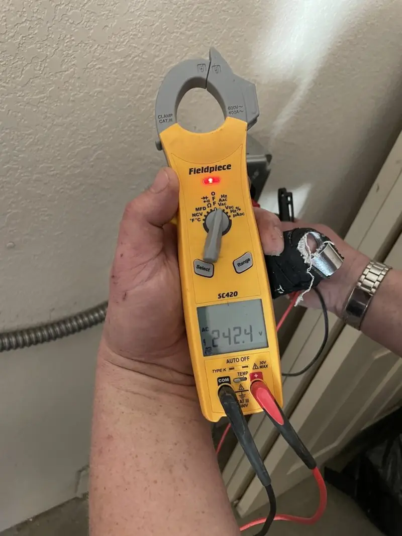 Voltage testing with clamp meter during Aluminum Wiring Replacement in Jacinto City